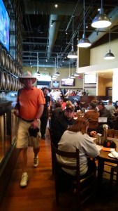 Ewisco walking into the Public House. 